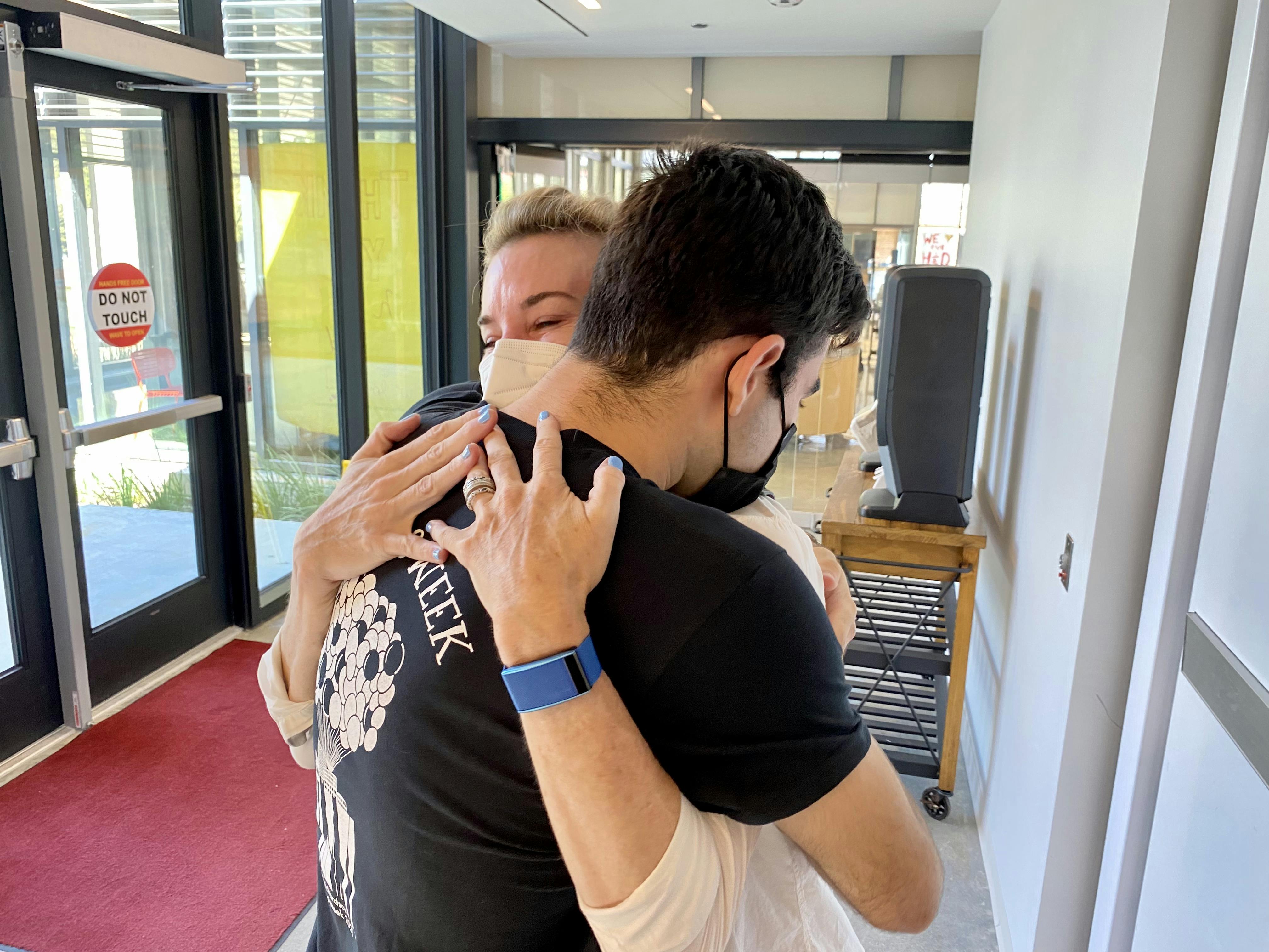 Mom and Son Hug at College Dropoff